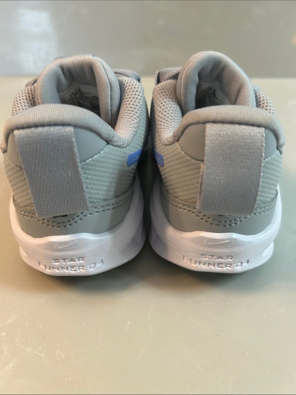 Nike Kids Grey Sneakers with Blue Swoosh